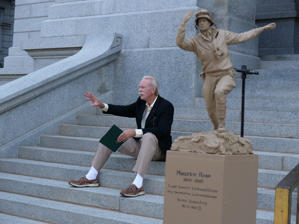 scultptor on steps of the Capitol Denver CO
