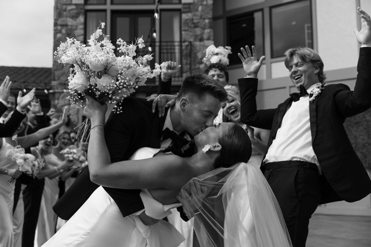 Black and White Wedding Photo Couple doing a dip and kissing 