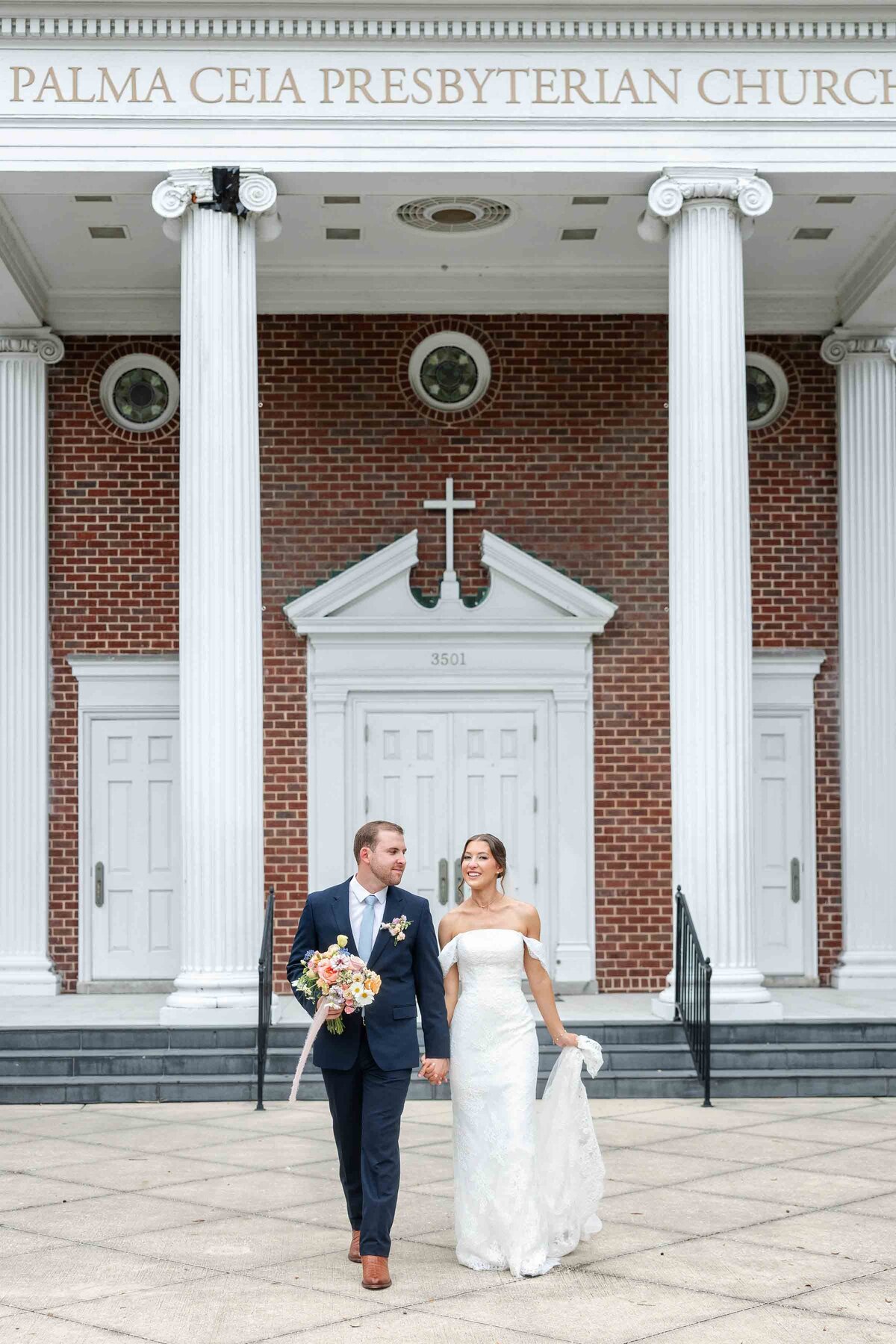 A bride and groom pose at the Palm Ceia Presbyterian Church in Tampa, Florida