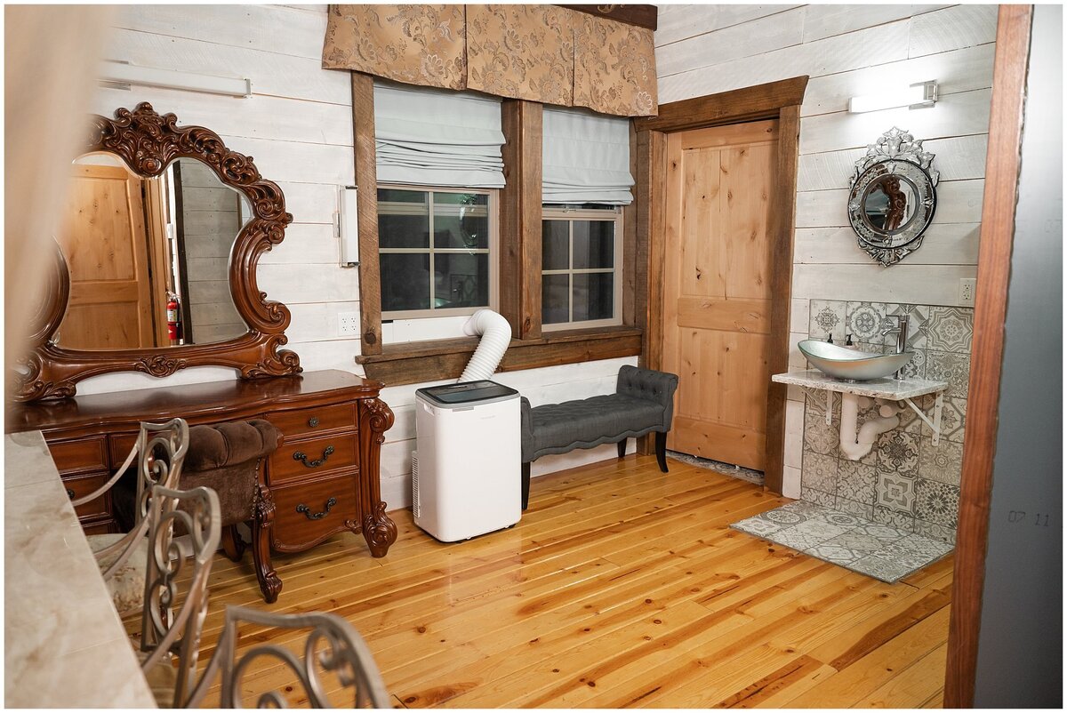 Bridal suite with vintage couches and stained glass windows at Walker Farms