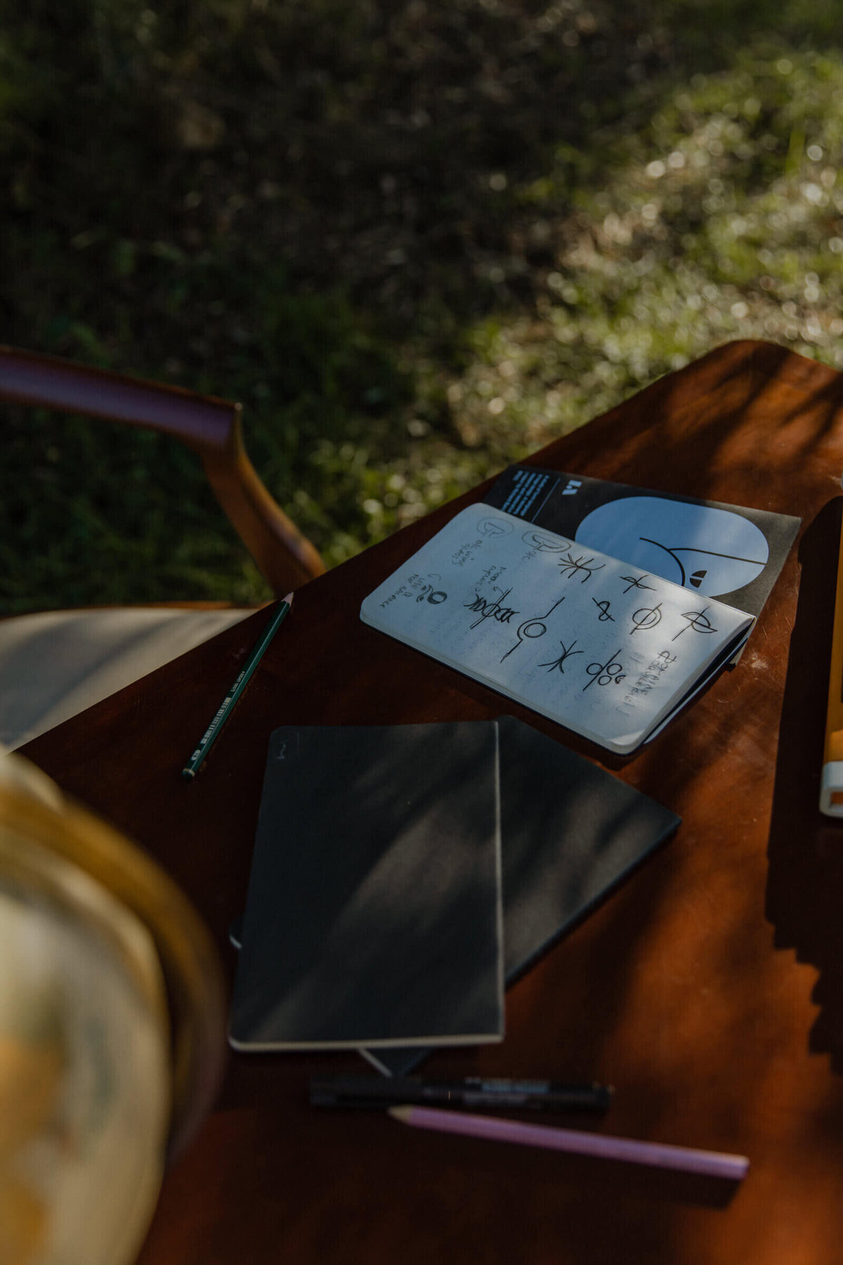 Close-up view of brand designer's desk featuring design materials and creative tools