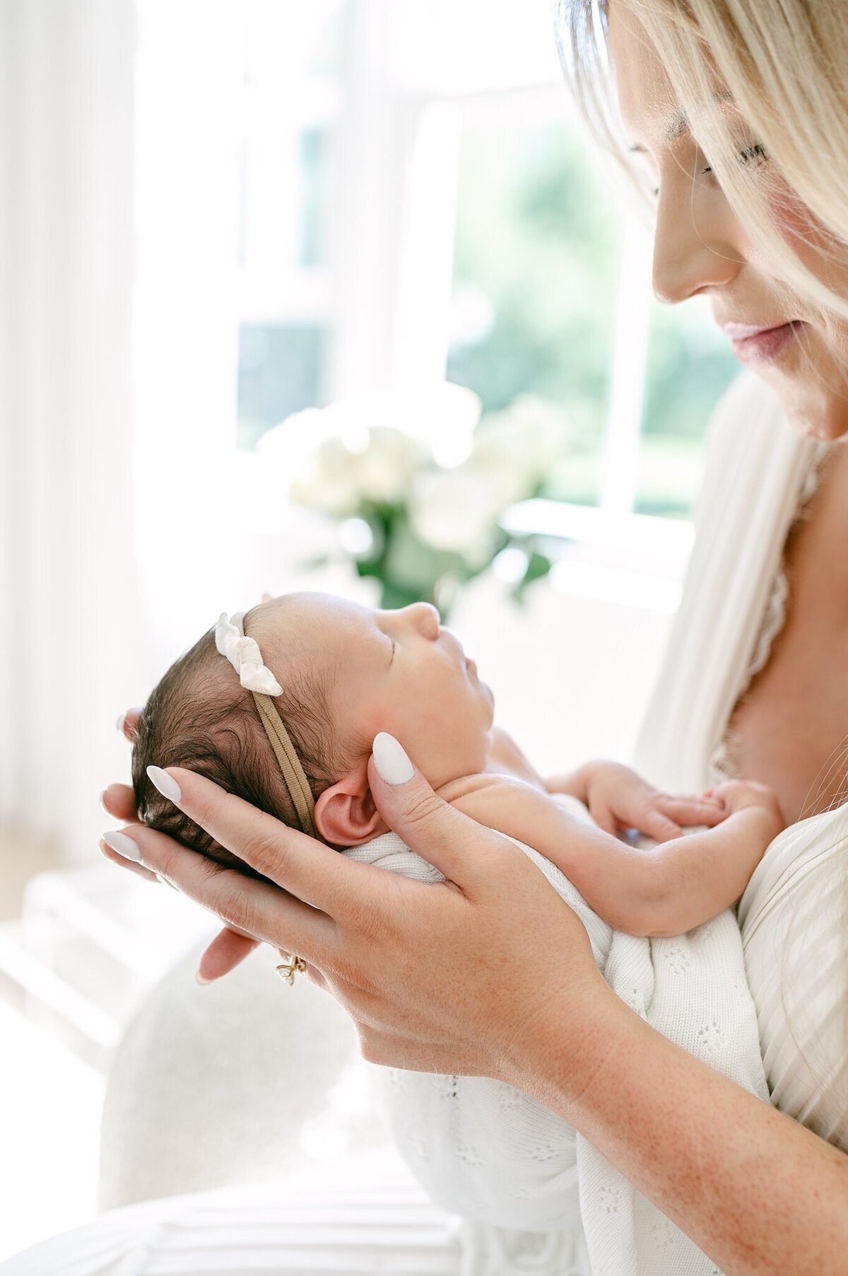 close up of a side profile of a newborn baby's face