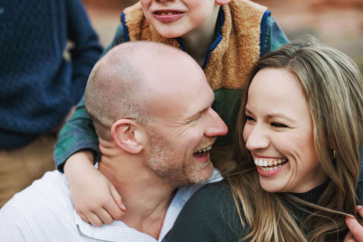 Family laughing with each other in the mountains