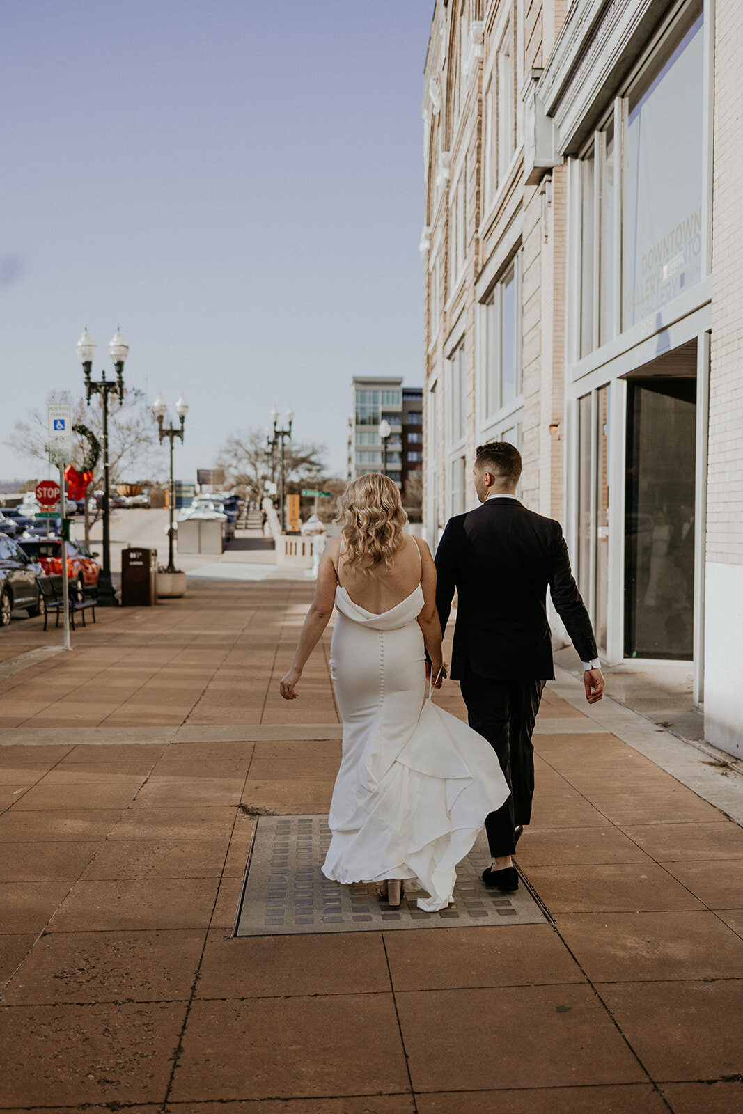 bride and groom walking in downtown  Knoxville