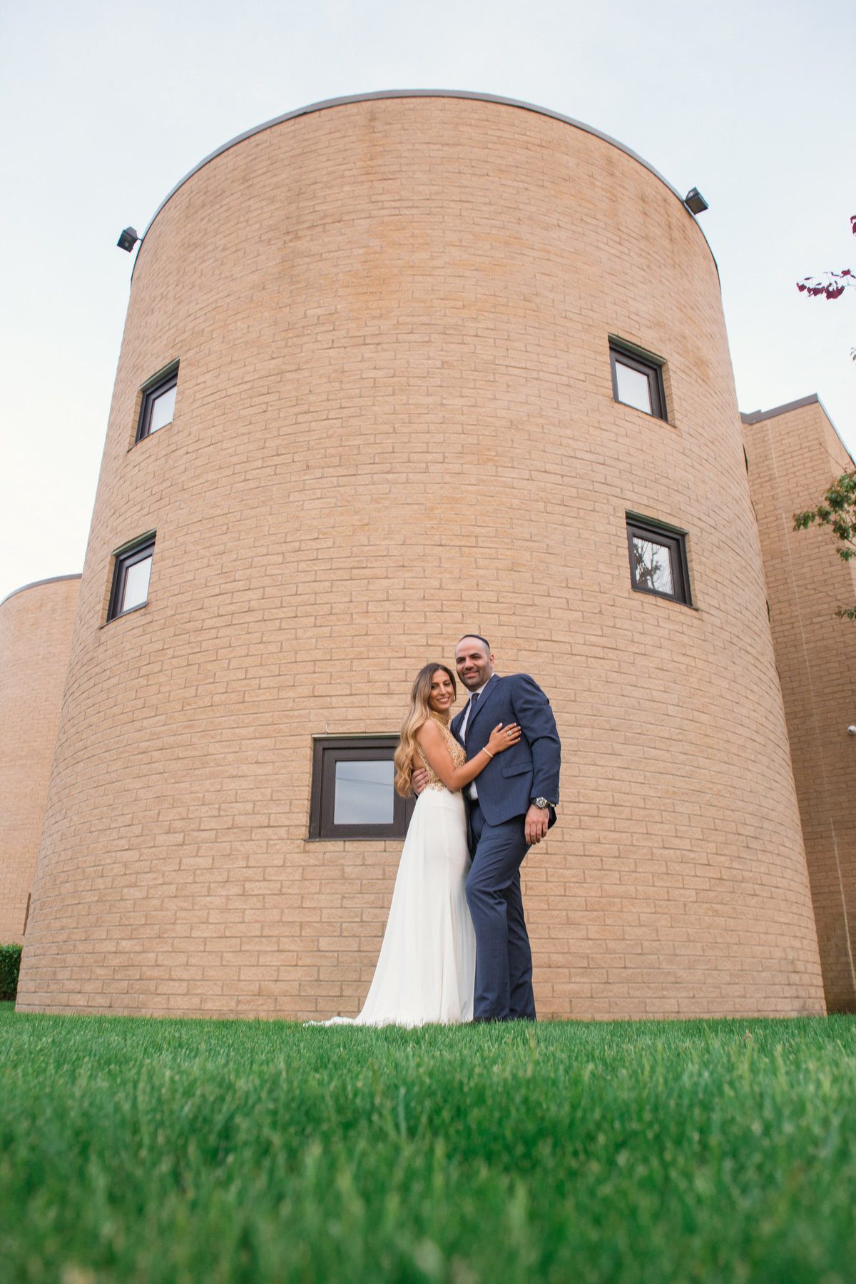 bride and groom photo outside wedding reception at Sephardic Temple