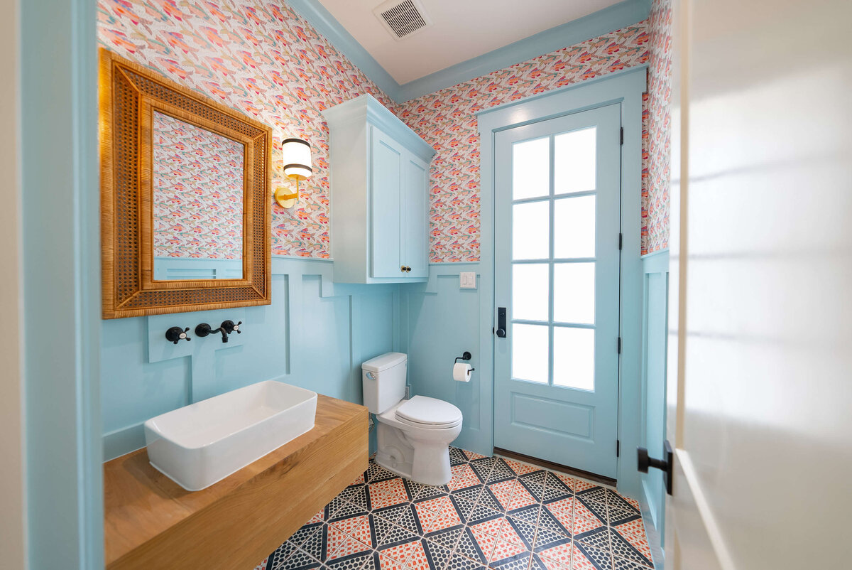 Pink and blue bathroom in high-end custom home near Southlake TX