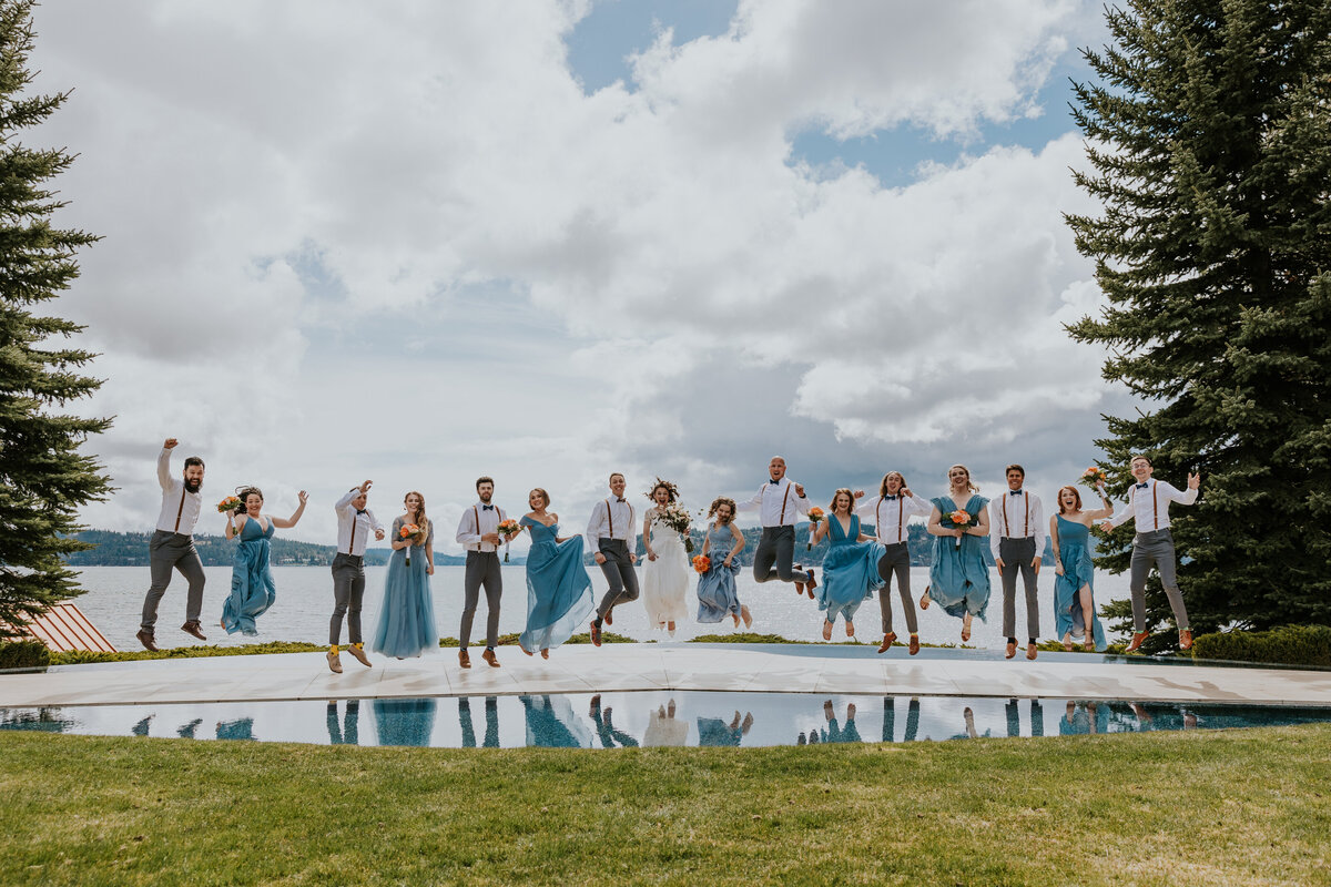 Bridal party jump in the air together at Coeur d'Alene golf course.