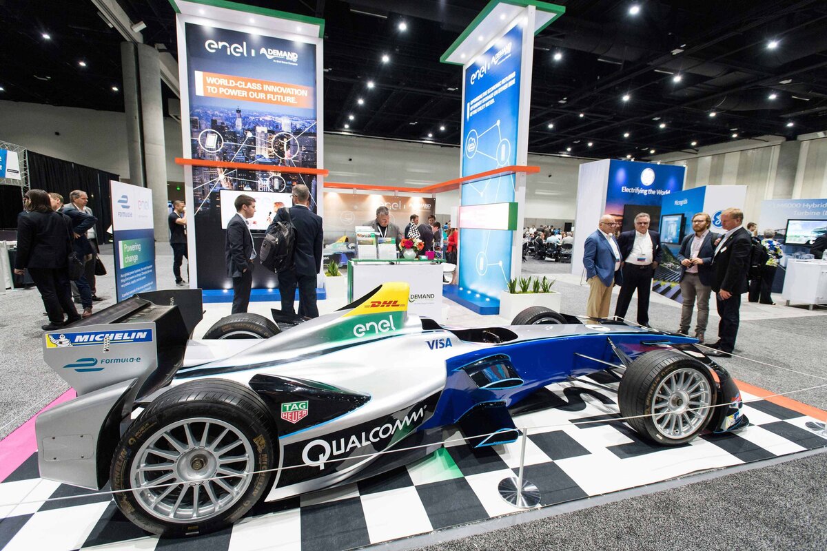 A Qualcomm branded Formula 1 race car on display at an expo