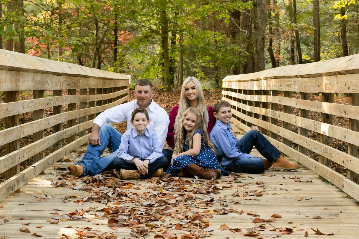 family portrait on bridge in fall
