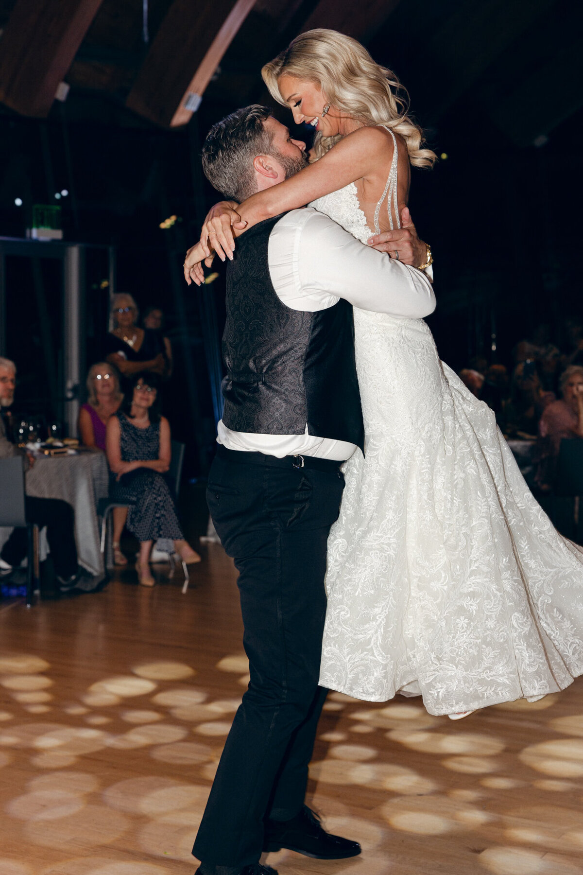 A wedding day photo of the bride and groom during their first dance at cRYSTAL bridges Museum of American Art
