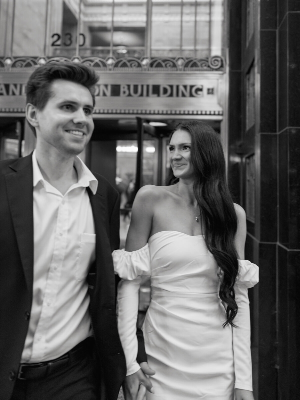 A couple poses inside the Pendry Chicago, capturing an intimate and stylish engagement session in the hotel’s elegant interiors.