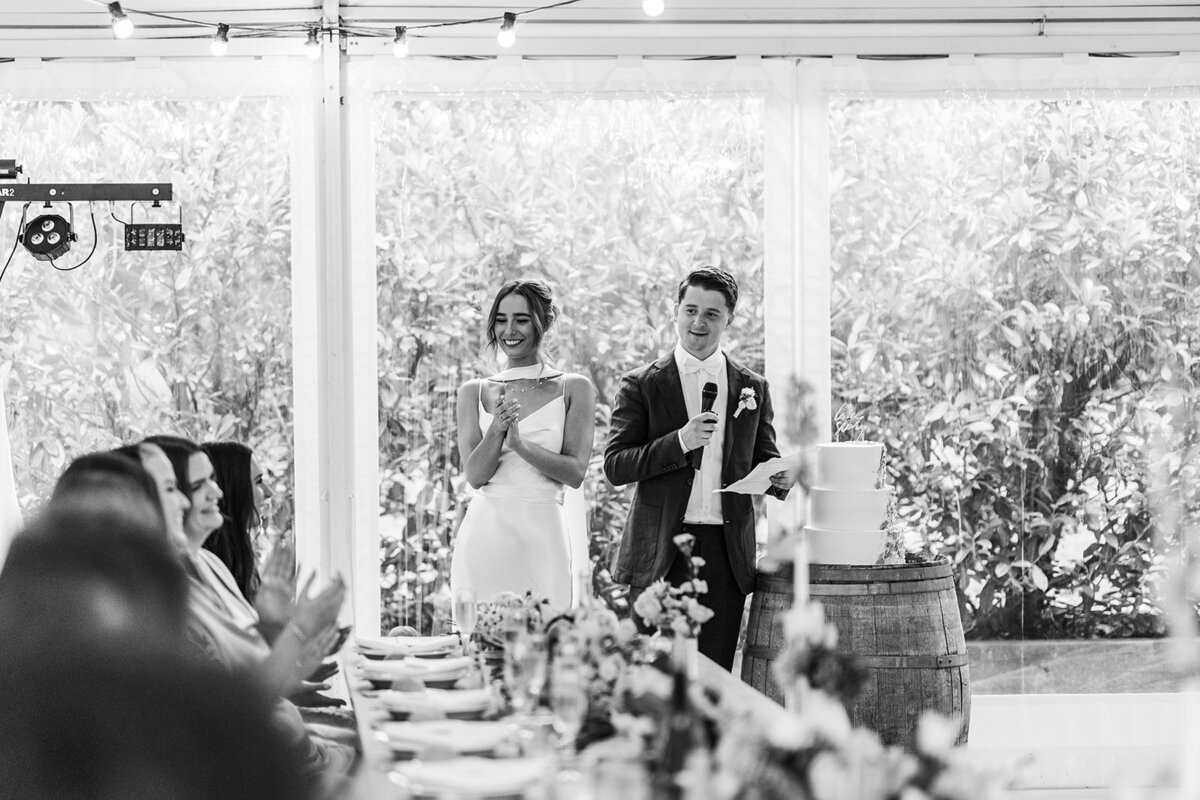 Bride and groom making their thank you speech during their wedding reception