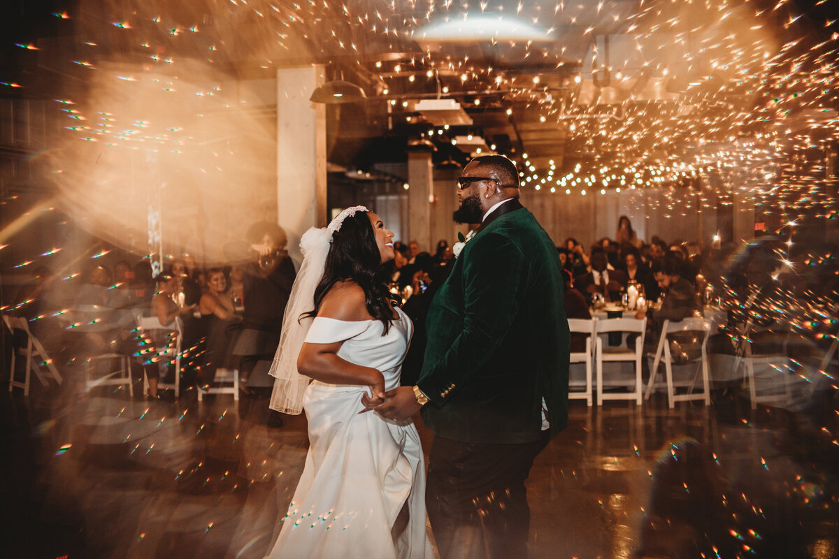 Maryland wedding photographer captures bride and groom dancing at their wedding reception at their Baltimore wedding venue