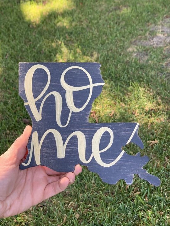 Home hand lettered on Louisiana state shape