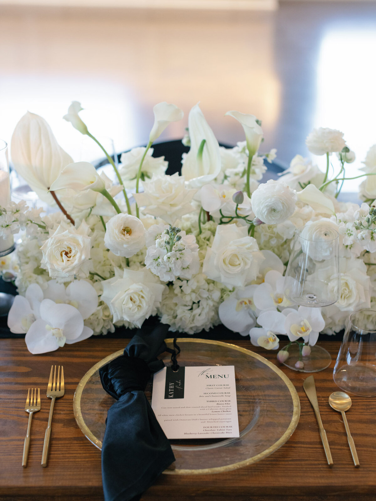 Beautiful white floral centerpiece design by Heritage florals.