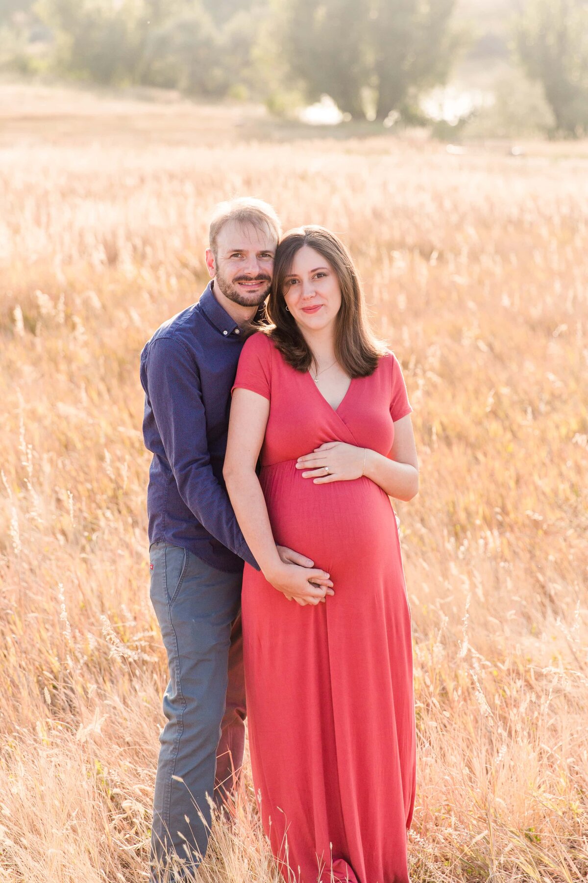 maternity session in a field with tall grass, Boulder, CO