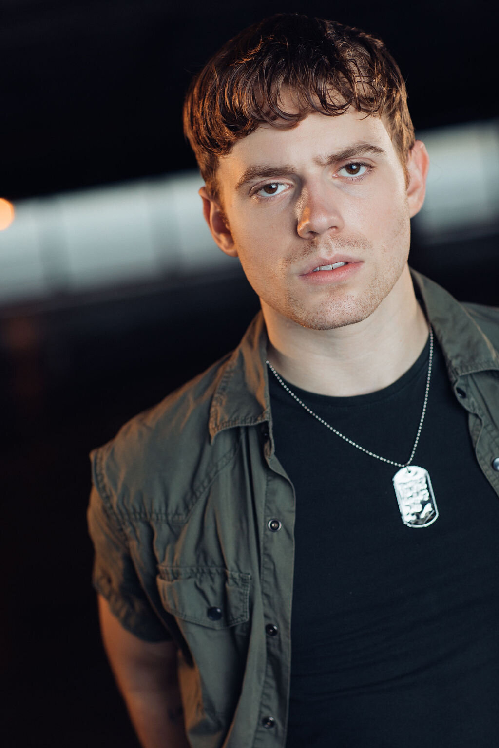 Young Man Wearing Gray Jacket with Dark Blue Inner Shirt and  Necklace Headshot in LA