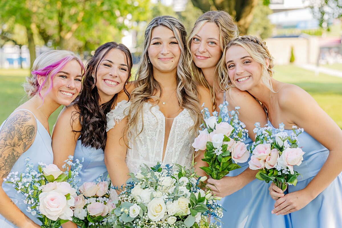 bride-and-bridesmaids-holding-blue-orchid-bouquets-freedom-hill