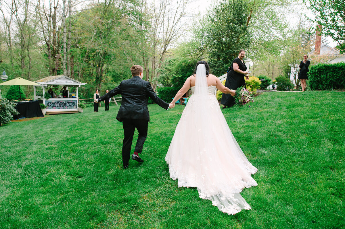 Two brides walking down the aisle after the ceremony