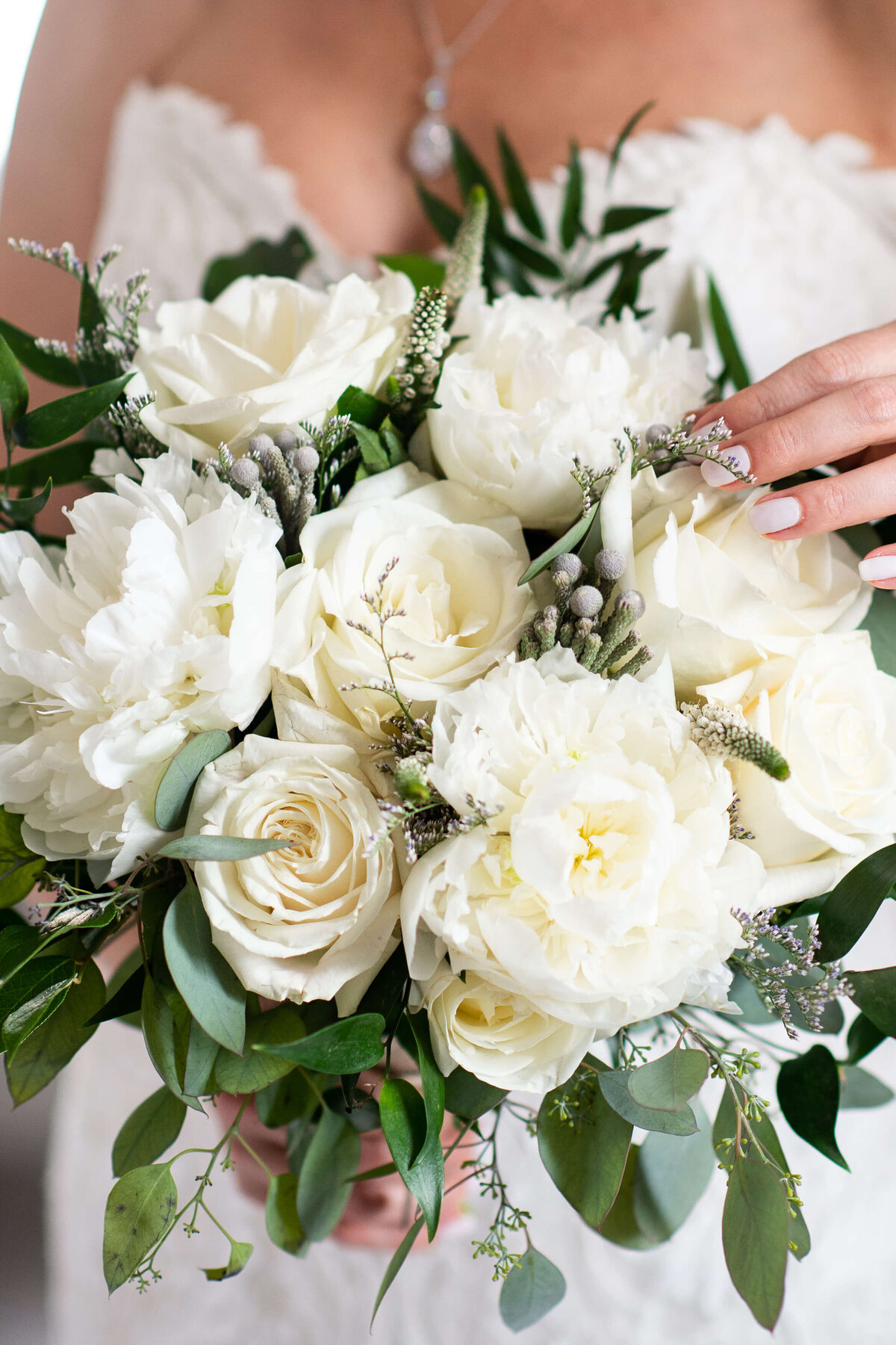 a closeup photo of a white bridal bouquet taken outside the Chateau Laurier as part of an Ottawa wedding