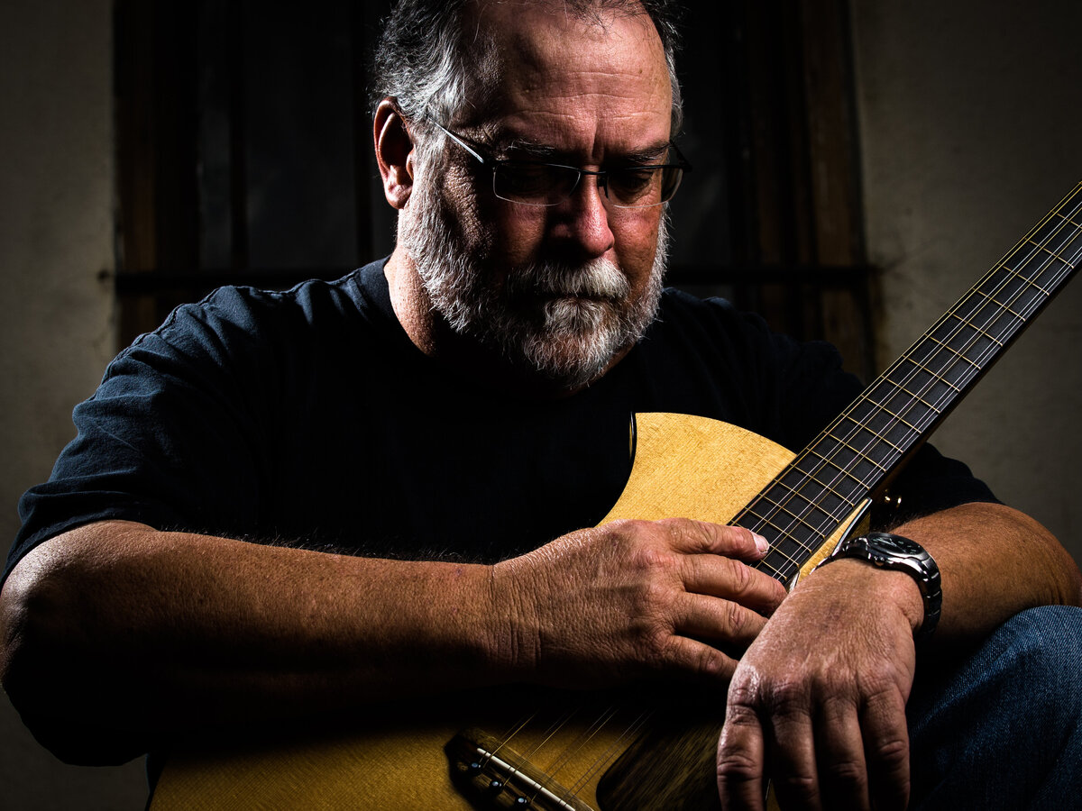Gifted Musician with his Hand-Made Guitar portrait