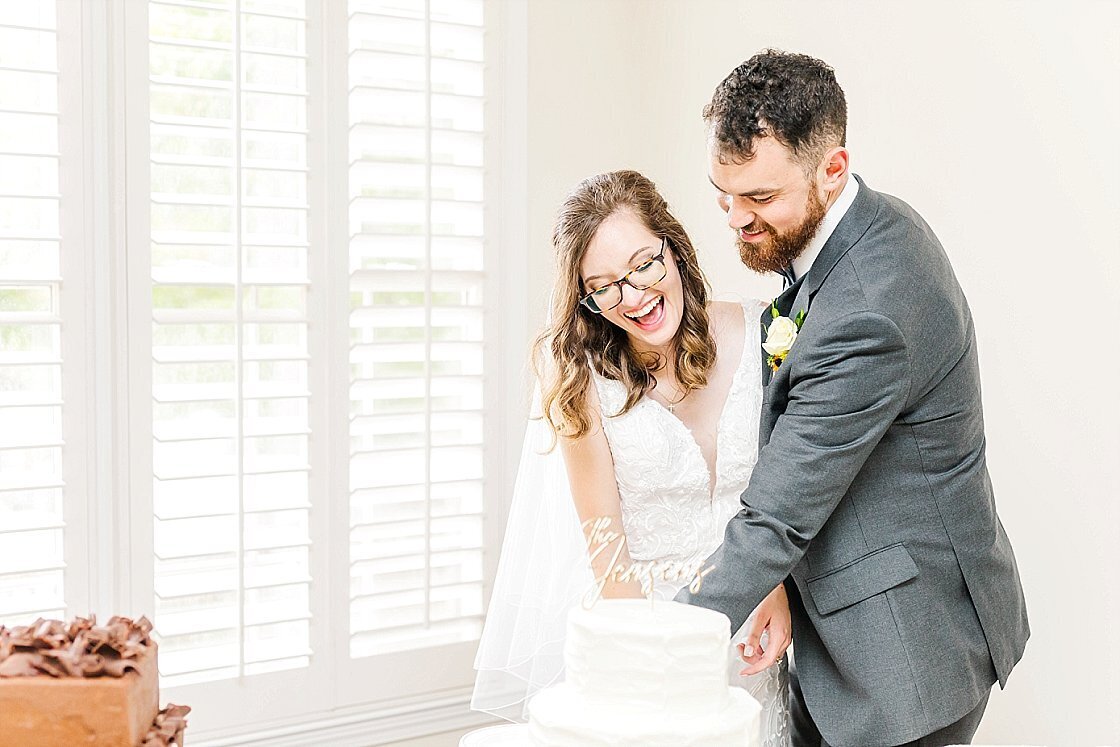 Bride and Groom cutting their cake at Alabama wedding. 
