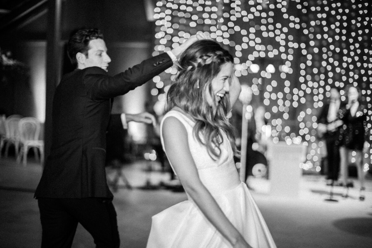 couple dancing with lights in background in san luis obispo at greengate ranch