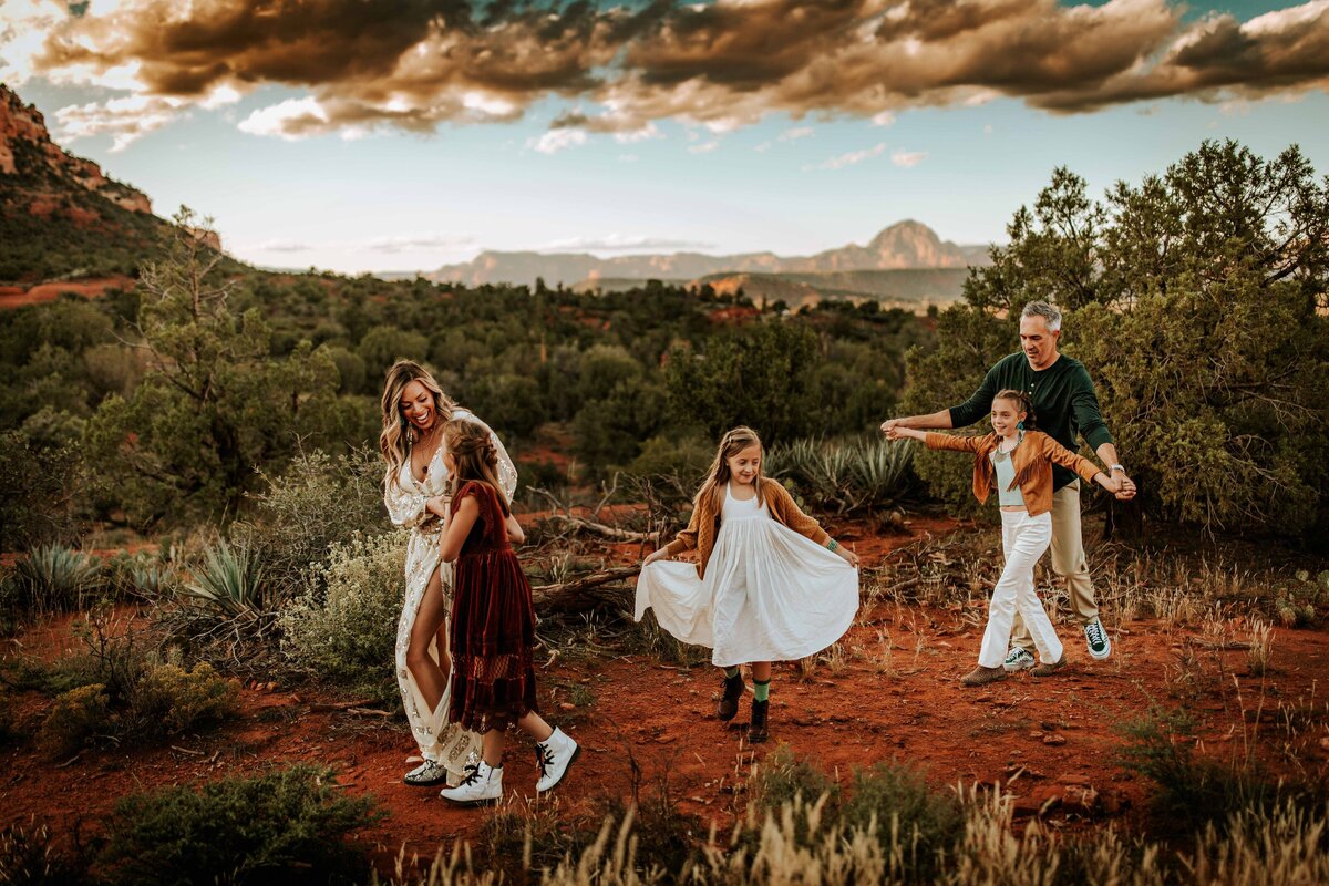 Family dancing on mountain