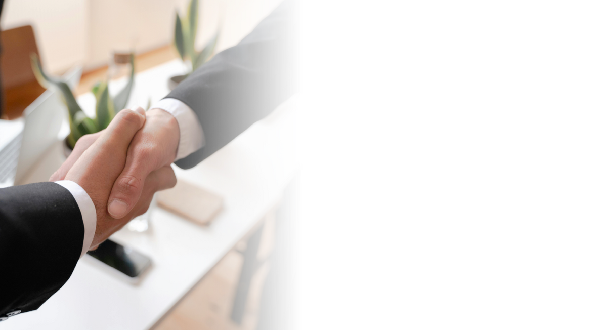 A Federated consultant shaking hands with a client who trusts us to provide advisory services that help them successfully buy or sell their funeral home.