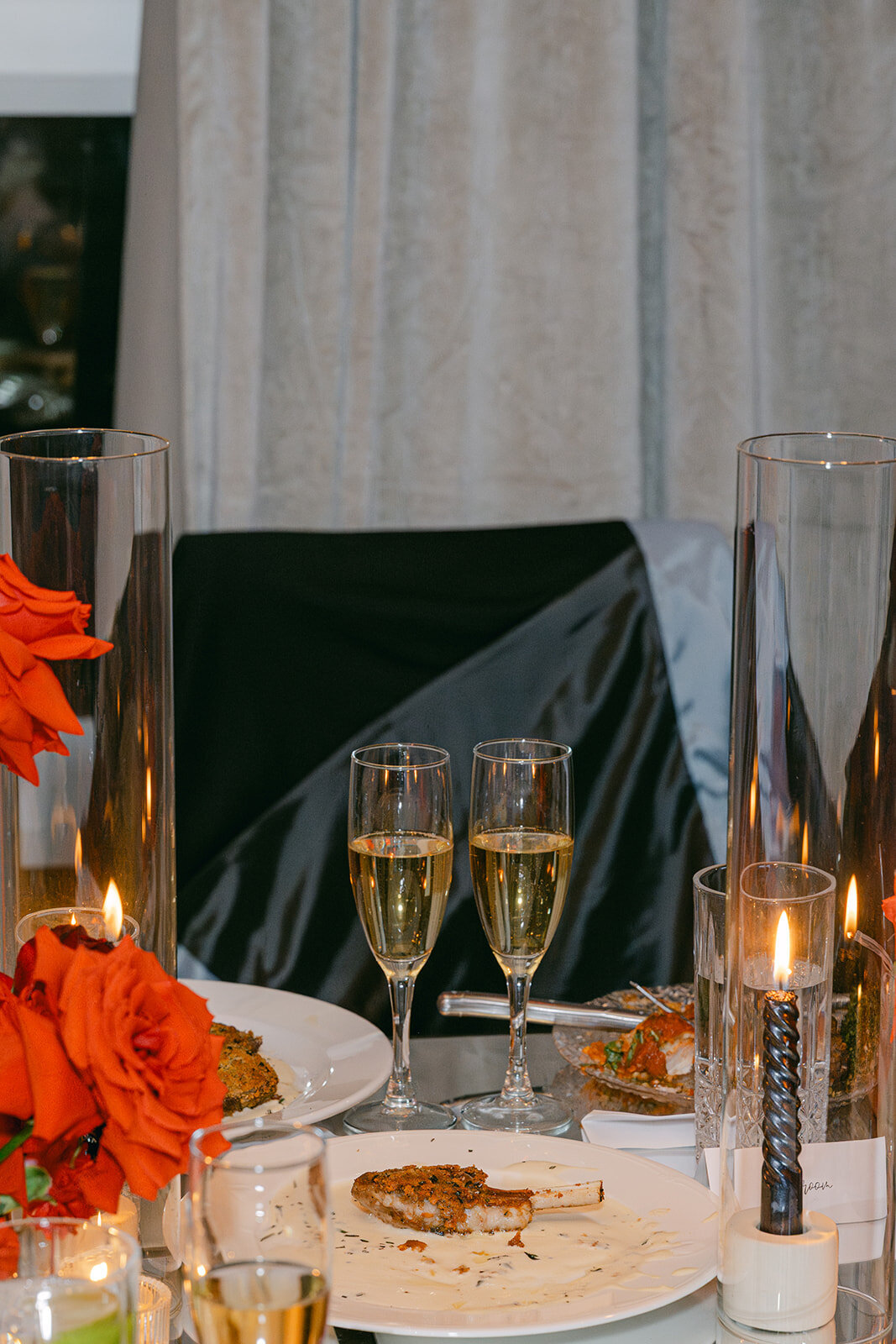 Minimalist celebration styling with bubbles and glass candlelight at upscale Texas venue