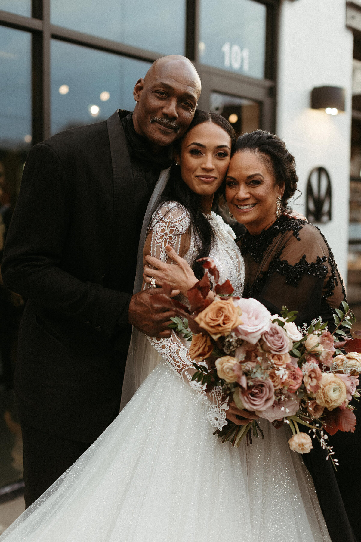 This elegant bridal bouquet brought hues of mauve, dusty pink, cream, burgundy, and terra cotta to this winter wedding. Lush with petal heavy roses, ranunculus, spray roses, copper beech, and greenery. Designed by Rosemary and Finch in Nashville, TN.