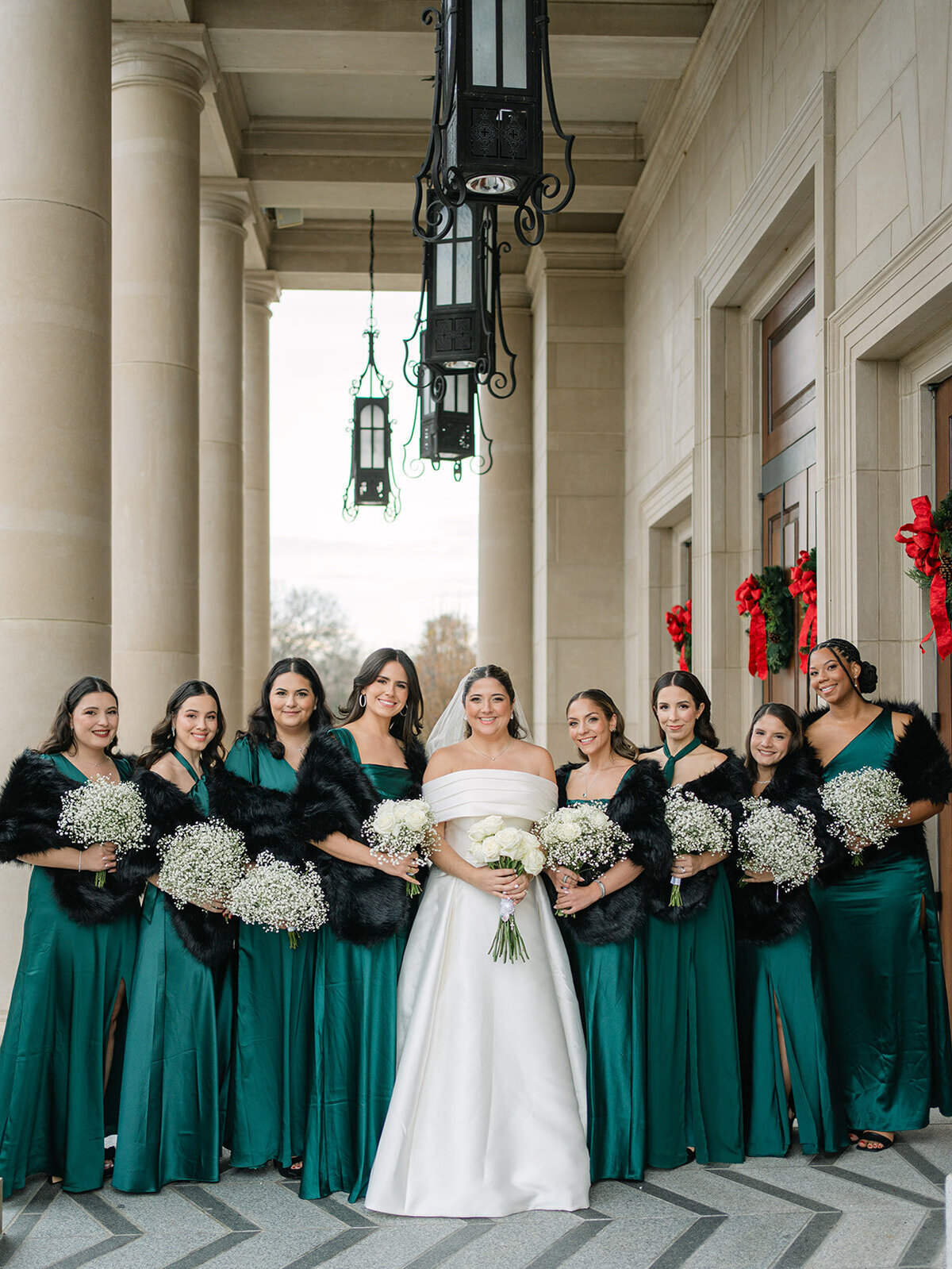 Bride and bridesmaids in green satin gowns and black shawls