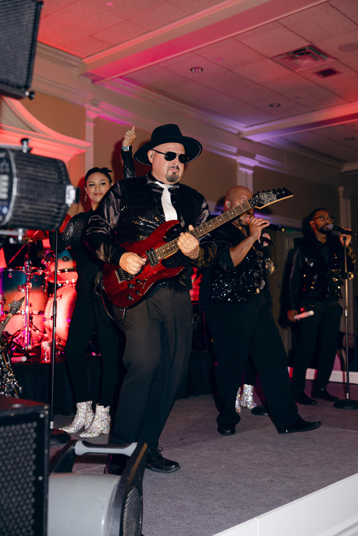 A wedding photo of the band during the wedding reception