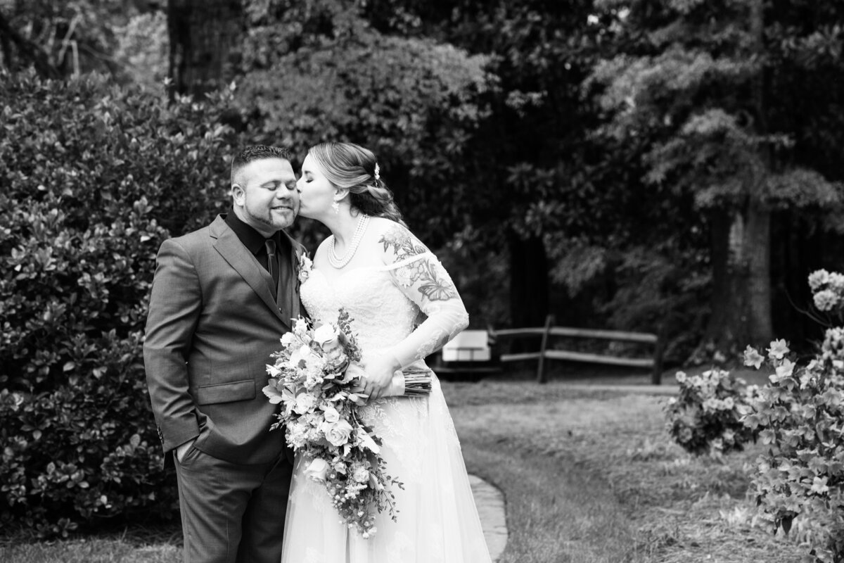 Carl-House-Auburn-GA-Bride-Kissing-Groom-Black-White-Wedding-Photography