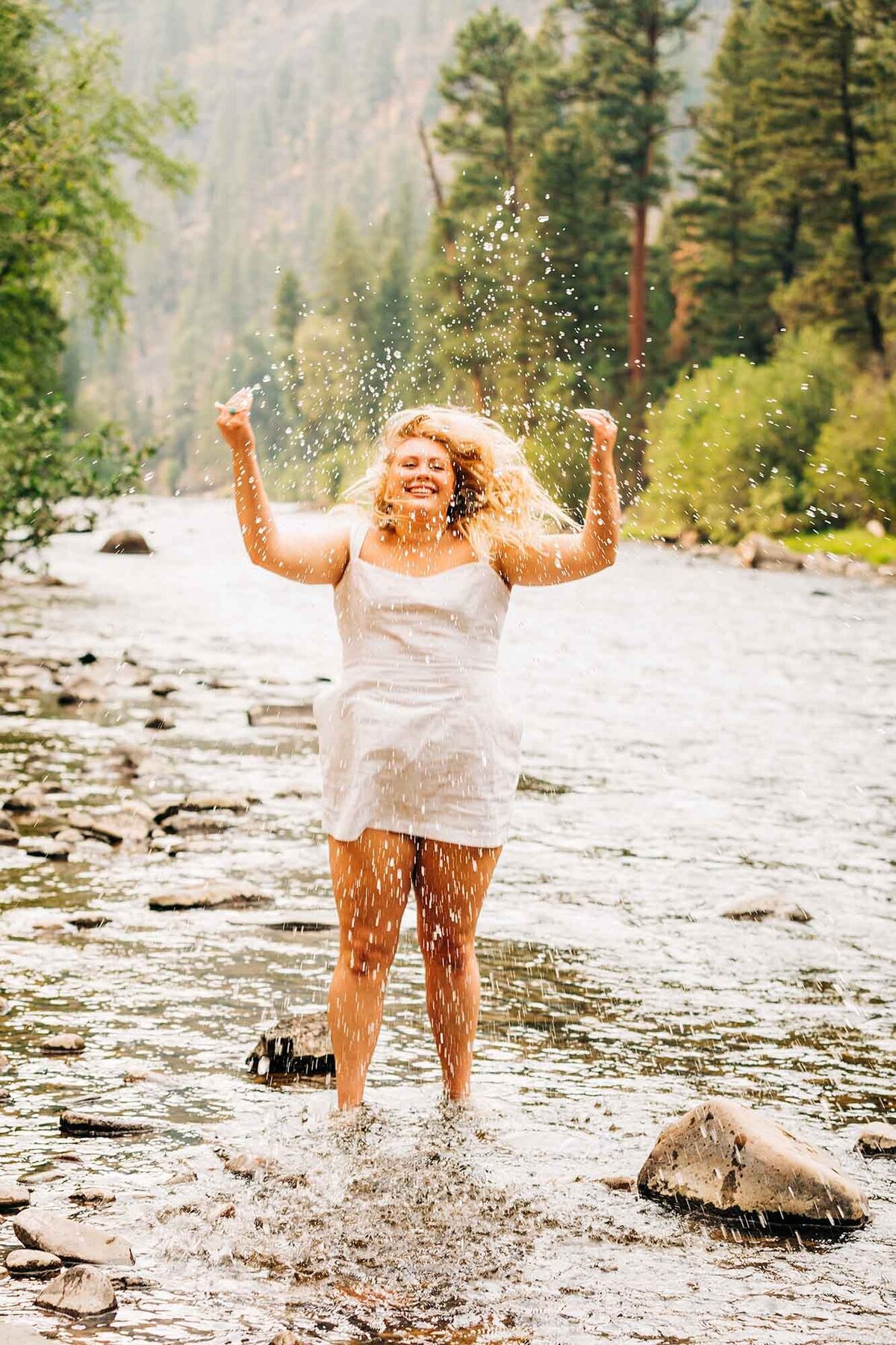 Missoula high school senior jumping with joy at Rock Creek