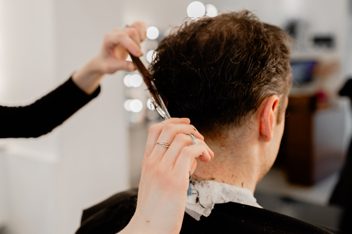 Man's hair being cut