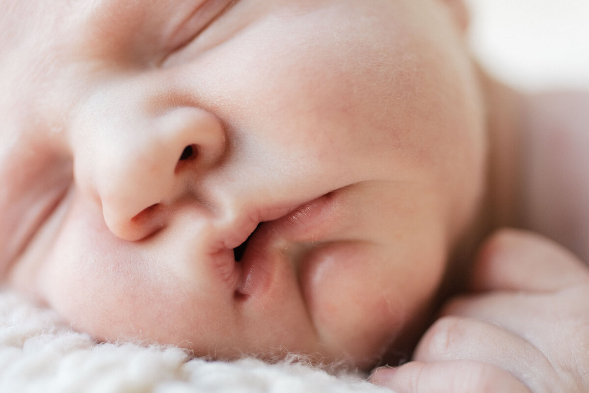 close up of babies face  by New Hampshire maternity photographer