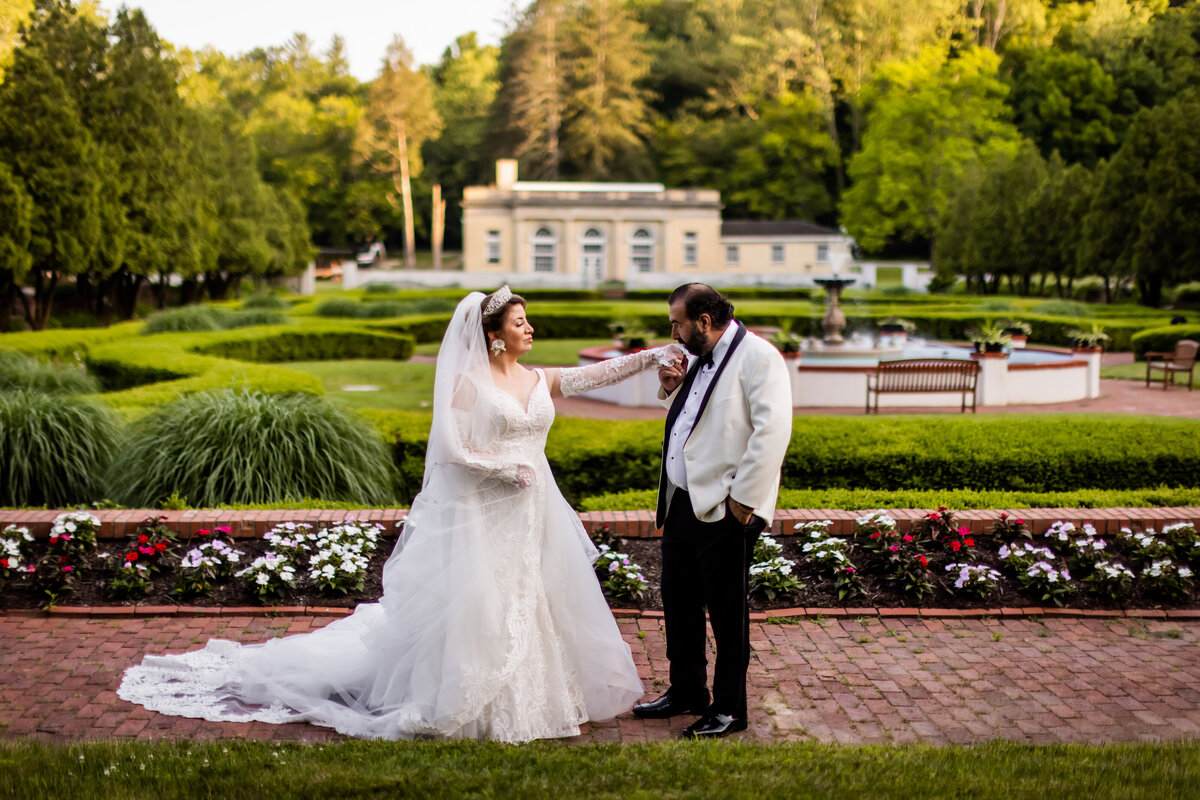 As the sun sets over West Baden Springs Resort, Maria and Pete are enveloped in a warm glow, creating a romantic and timeless wedding portrait.
