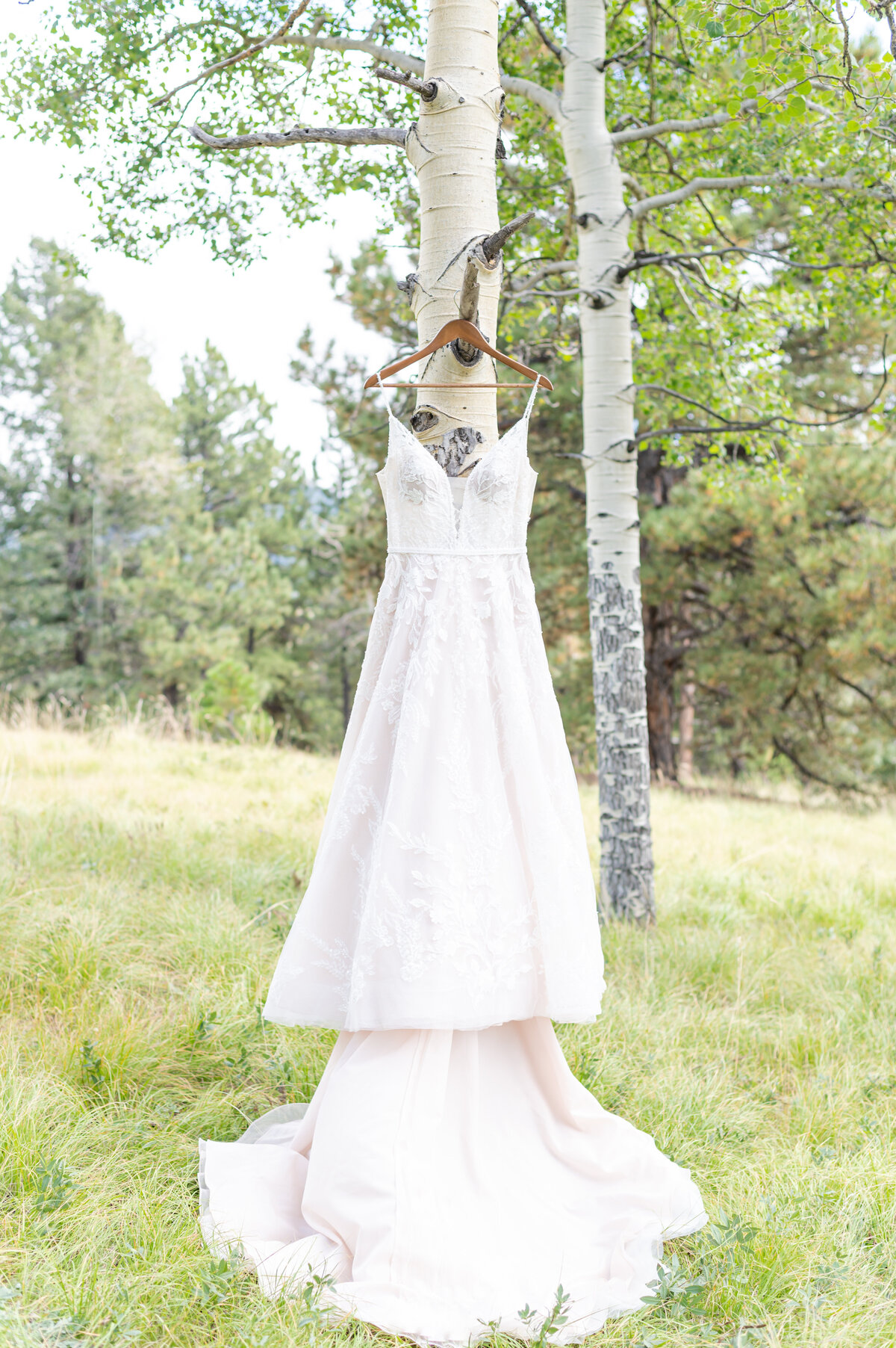 Detail photo of the bride's dress on their elopement day in Colorado