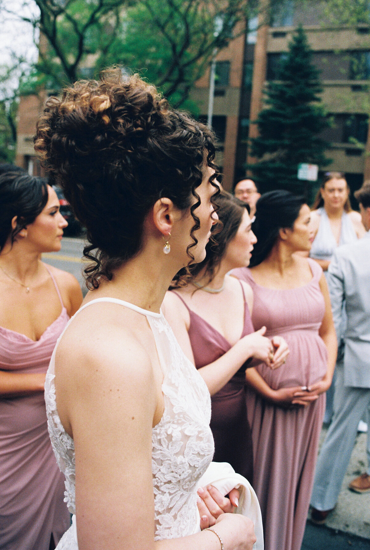 bride holding dress with birdy grey bridesmaid dresses