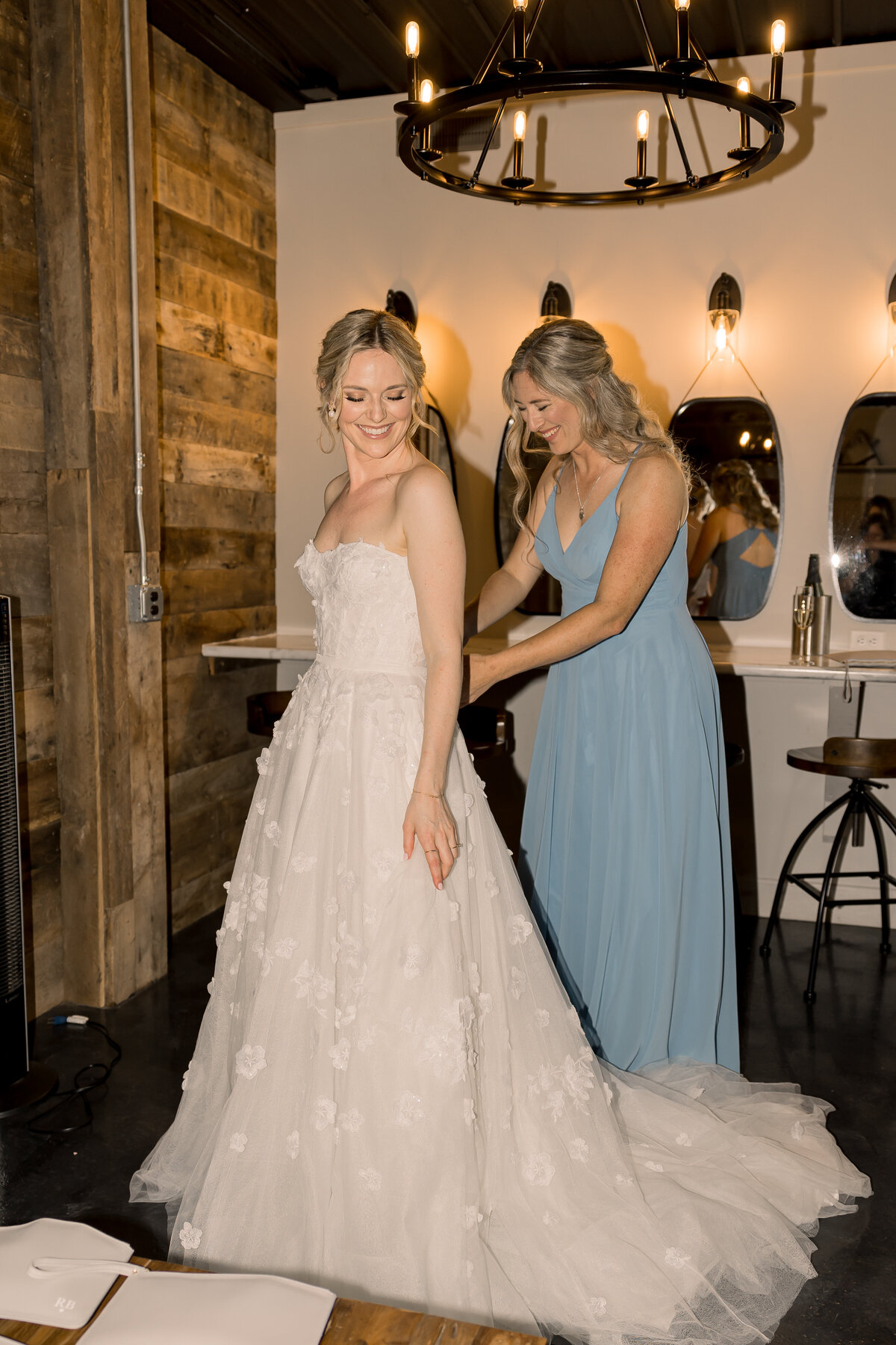 Bride getting ready on wedding day at Carlos Creek Winery in Alexandria MN