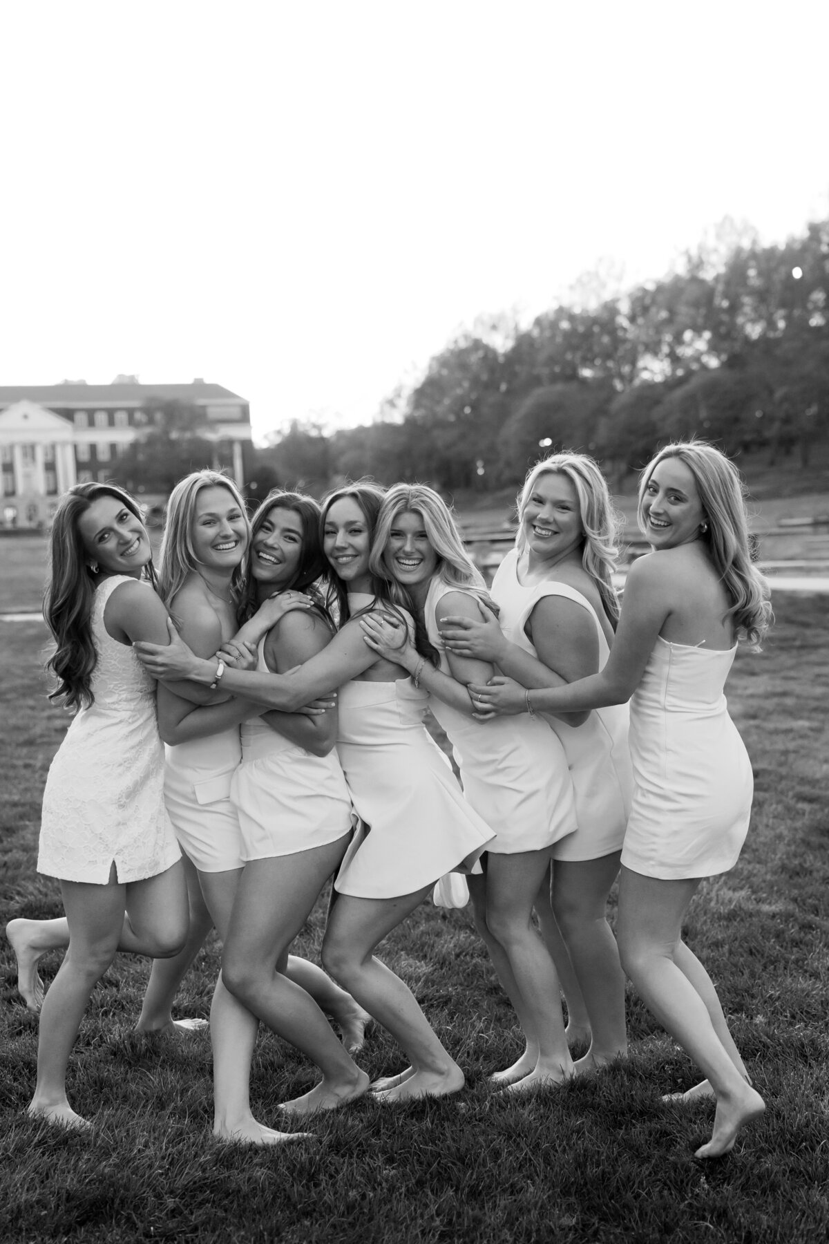 University of Maryland Best friends Graduates at McKeldin Mall in College Park Maryland Captured by UMD Graduation Photographer Brenna Marie Photography