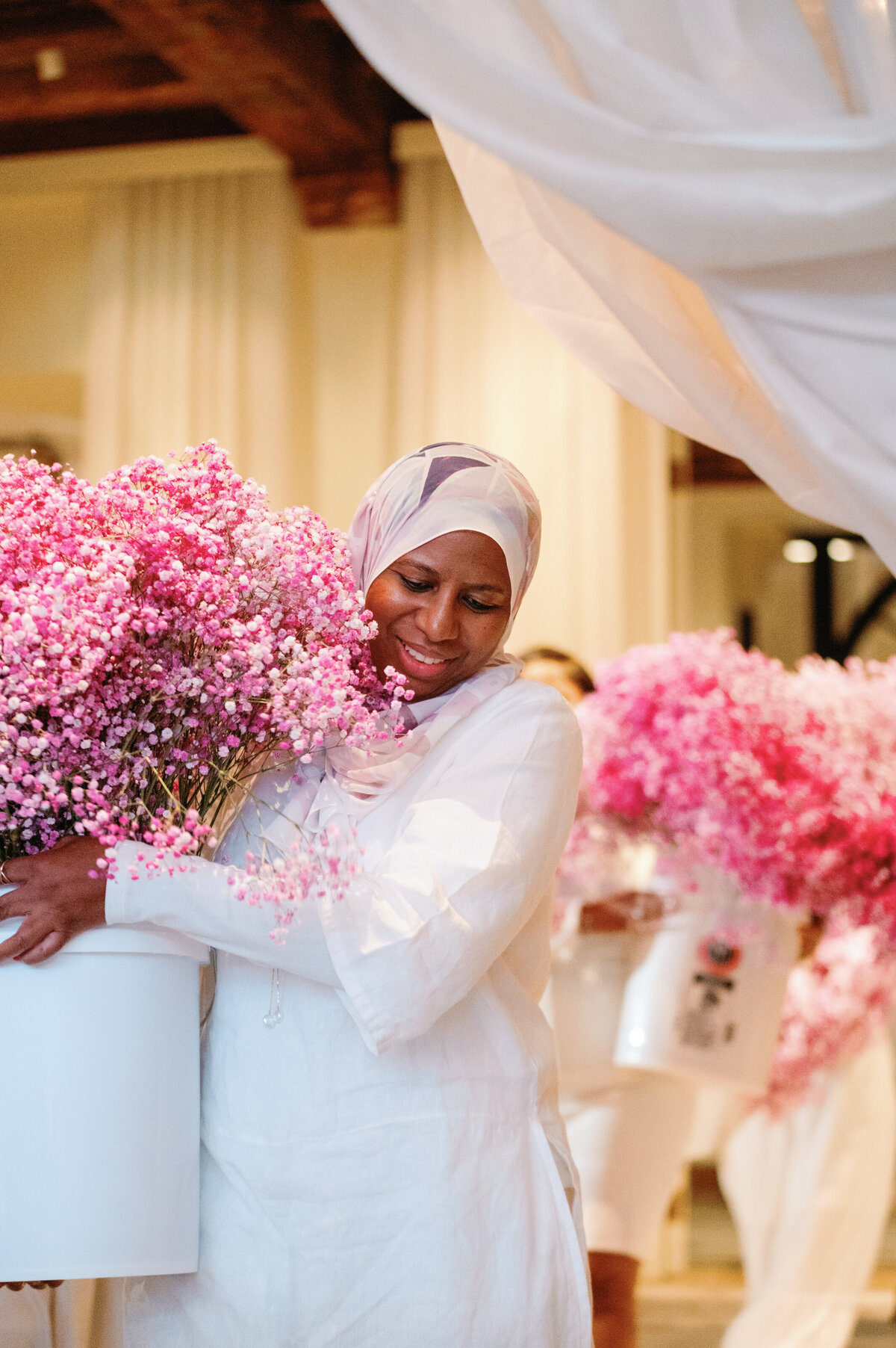  carrying an abundance of pink baby's breath, showcasing a delicate and dreamy floral design, designed by In Full Bloom Event Planning & Design