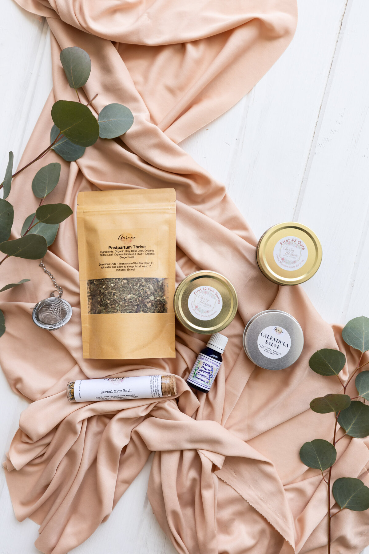 Dried postpartum tea in a bag with glass jars