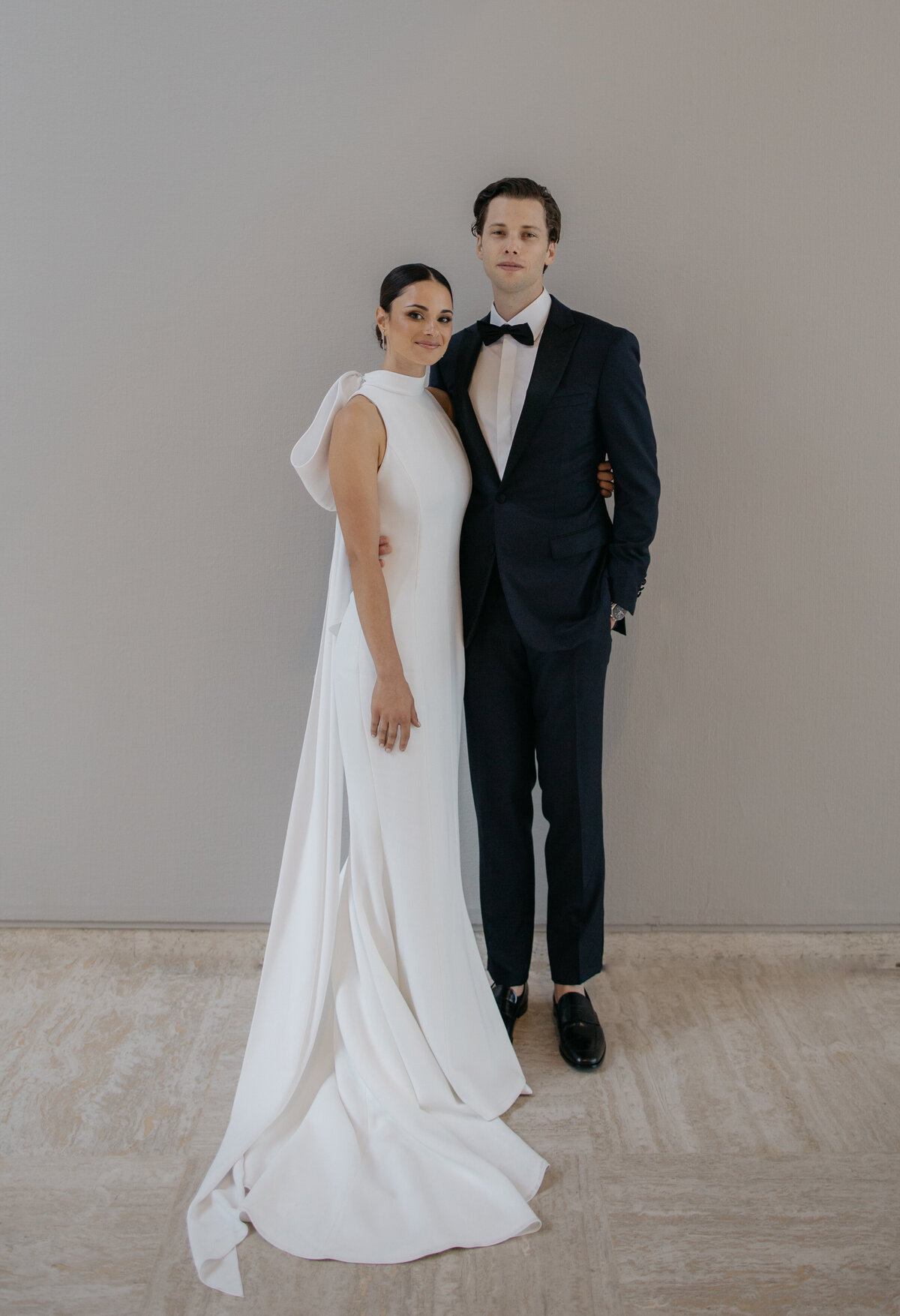 Bride and Groom smile for a casual portrait in the Art Museum