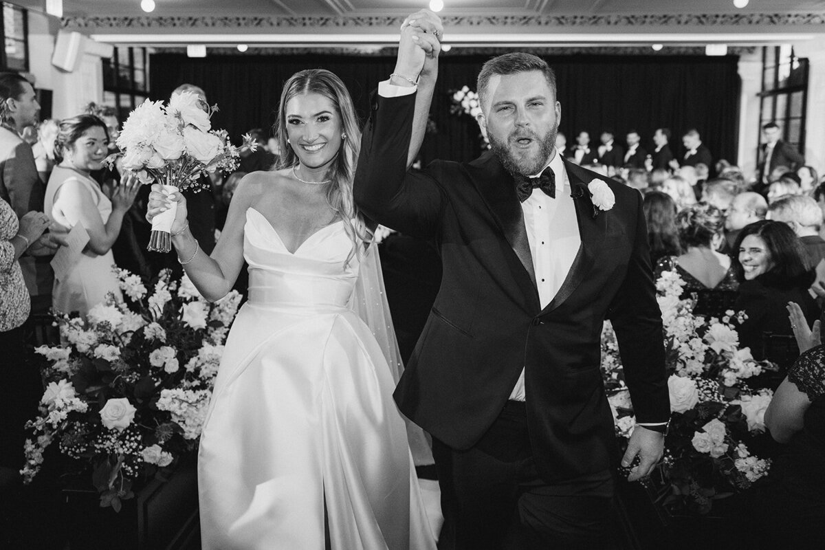 newlyweds-processional-black-and-white-revel-motor-row-HBICWeddings