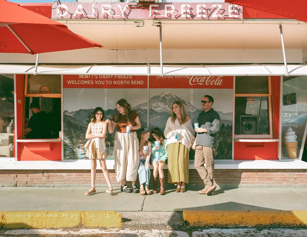 family of five outside ice cream parlor for summer photos