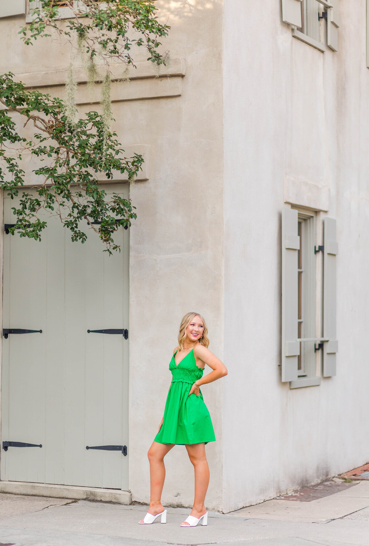 senior girl smiling in green dress