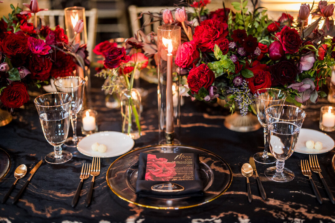 Taper candles, gold accents, wedding menu, gold charger, red flowers