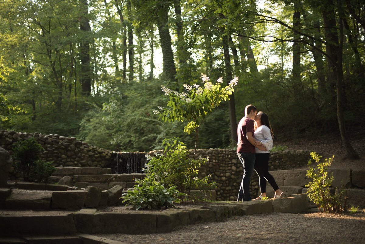 couple kisses in the canton garden center woods